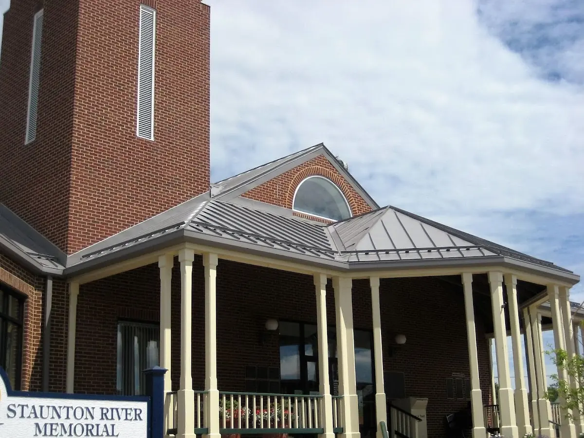 Skilled roofing craftsmen working on a residential roof in Liberty Hall